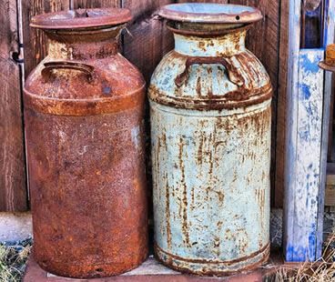 Shot blasting rusty cans image